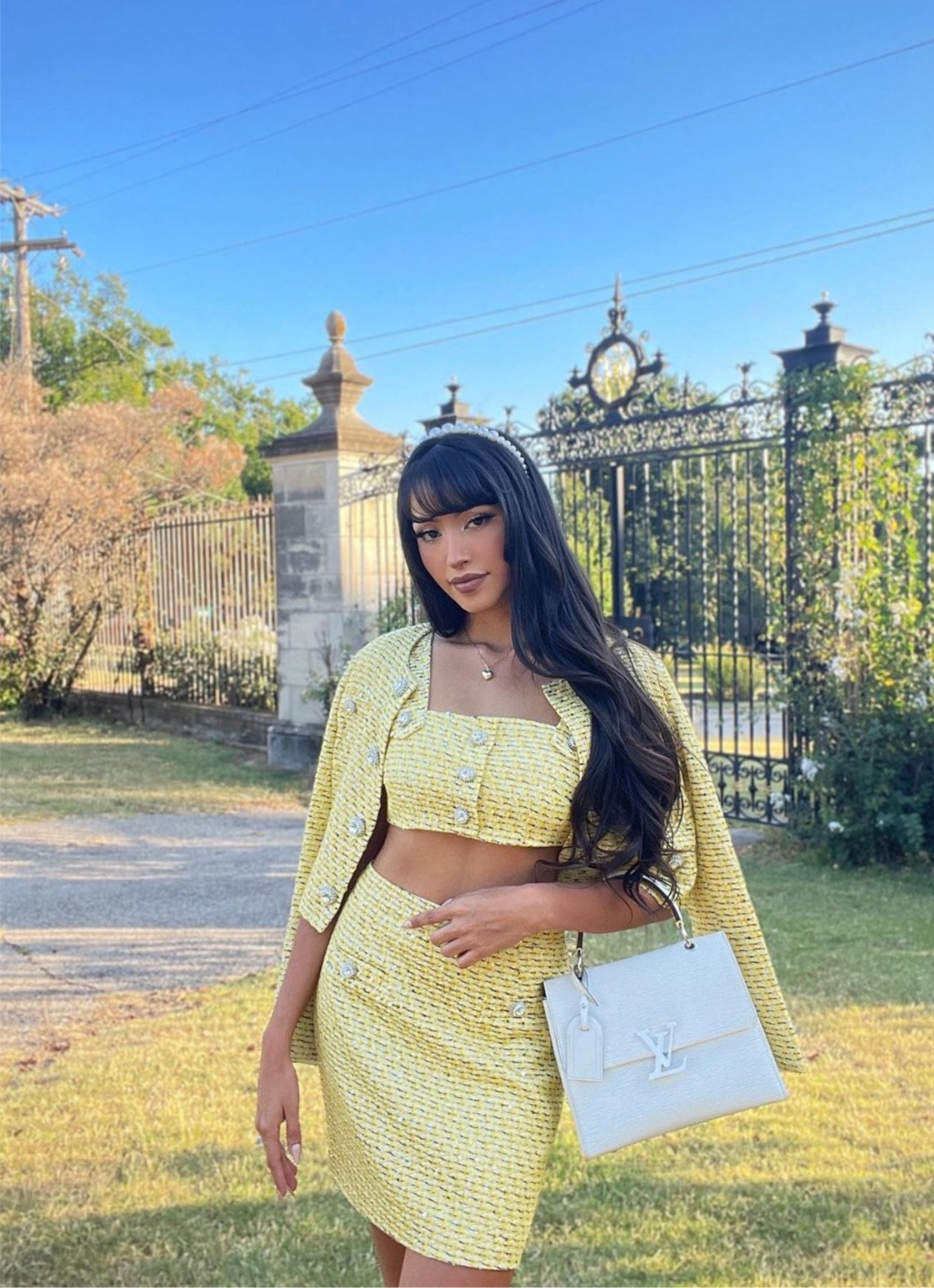 Yellow tweed bra, skirt and jacket set with jewel buttons