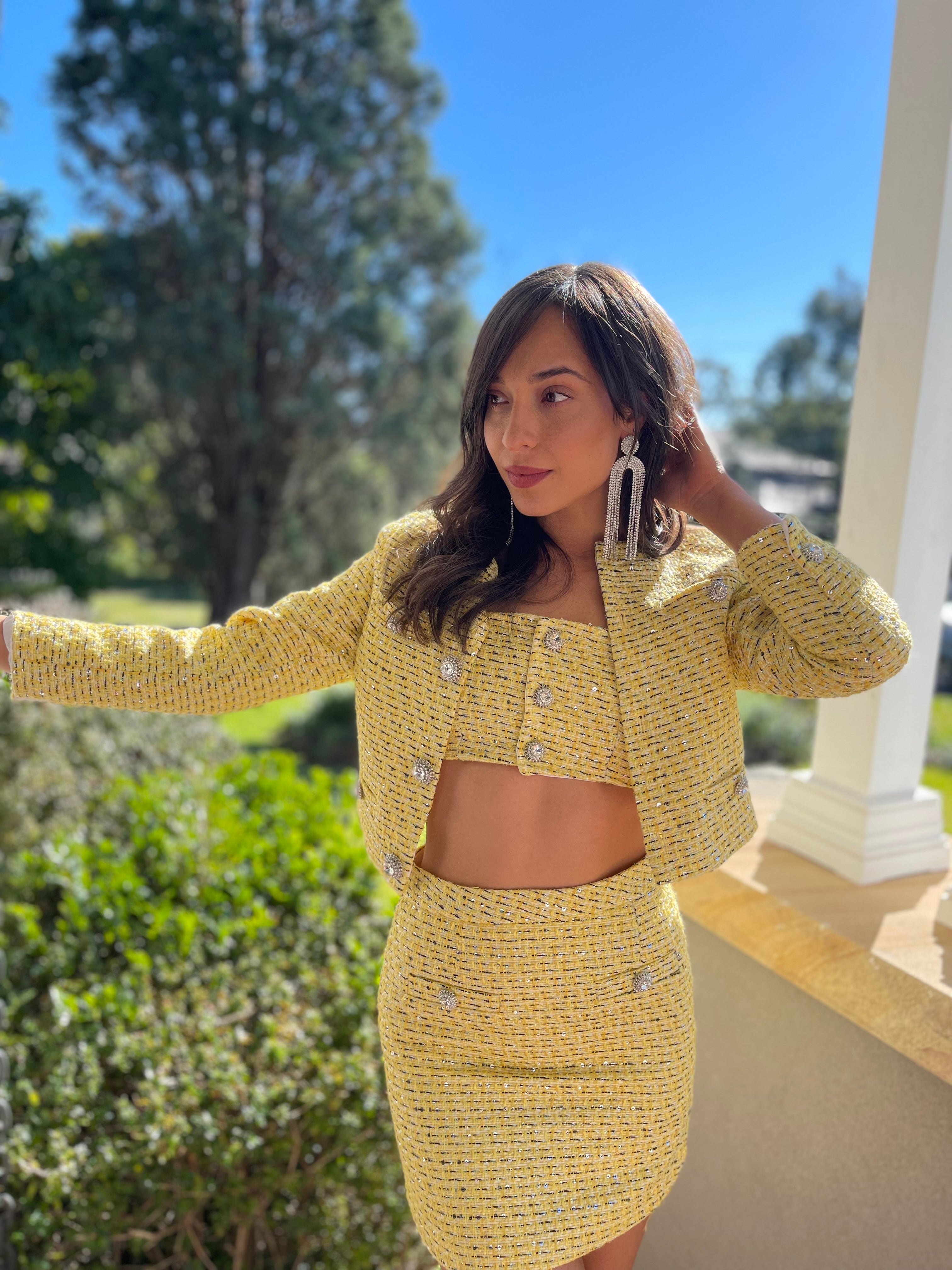 Yellow tweed bra, skirt and jacket set with jewel buttons