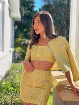 Yellow tweed bra, skirt and jacket set with jewel buttons